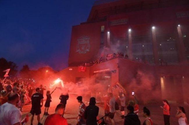 Liverpool Fans Defy Police Warnings, Gather At Anfield To Celebrate On PL Trophy Night